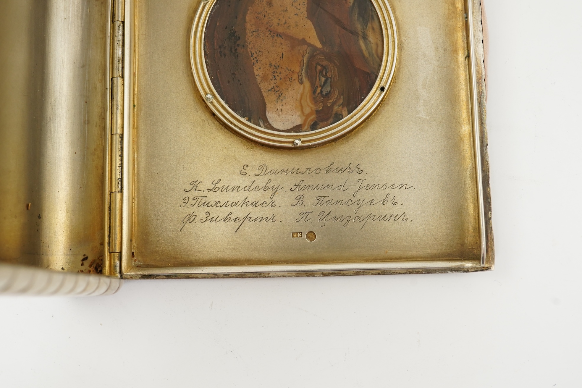 An early 20th century Russian 84 zolotnik silver cigarette case, with cappuccino agate inset cover, of ribbed rectangular form